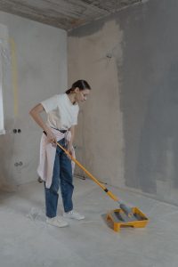 Woman Painting the Wall