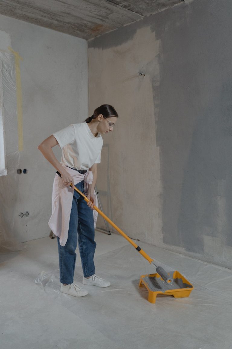 Woman Painting the Wall